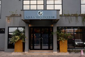 Villa Monticello hotel main entrance door, showcasing an elegant design that invites guests into a luxurious and welcoming atmosphere.