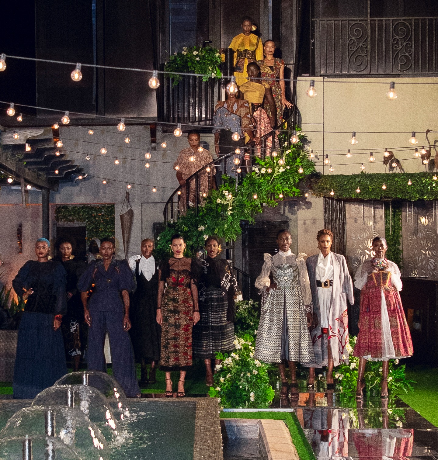 Two diverse members smiling together in a hotel setting.