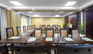 Dining room with a table surrounded by chairs, creating an inviting space for meals and gatherings.