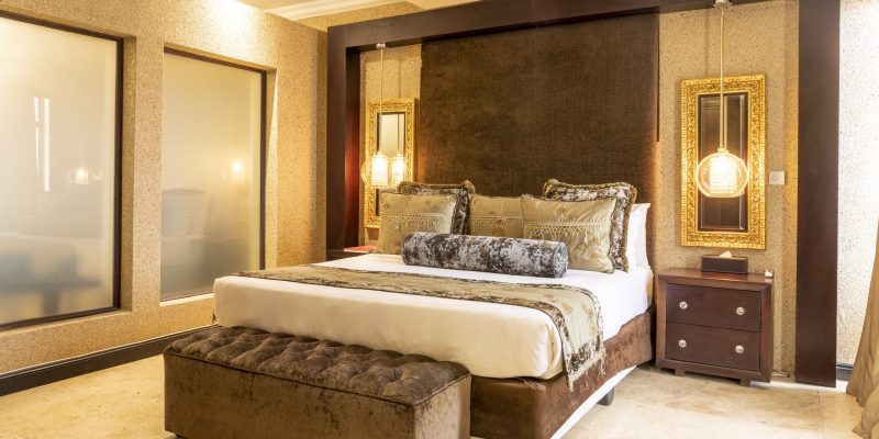 Kwame Nkrumah Presidential Suite bed area showcasing an elegant king-sized bed with luxurious linens, sophisticated decor, and tasteful furnishings, creating a plush and inviting atmosphere.