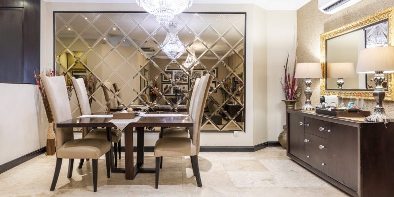 Kwame Nkrumah Presidential Suite dining area showcasing an elegant dining table with sophisticated seating, beautifully set against a backdrop of stylish decor and soft lighting for a luxurious dining experience.